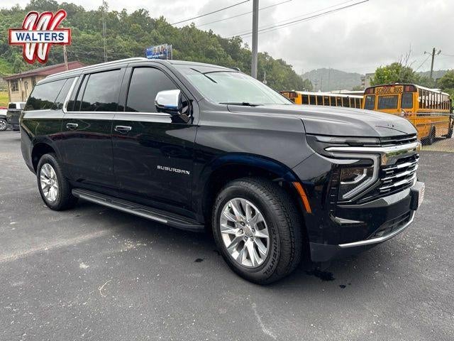 2025 Chevrolet Suburban 4WD Premier in Black — front three-quarter view