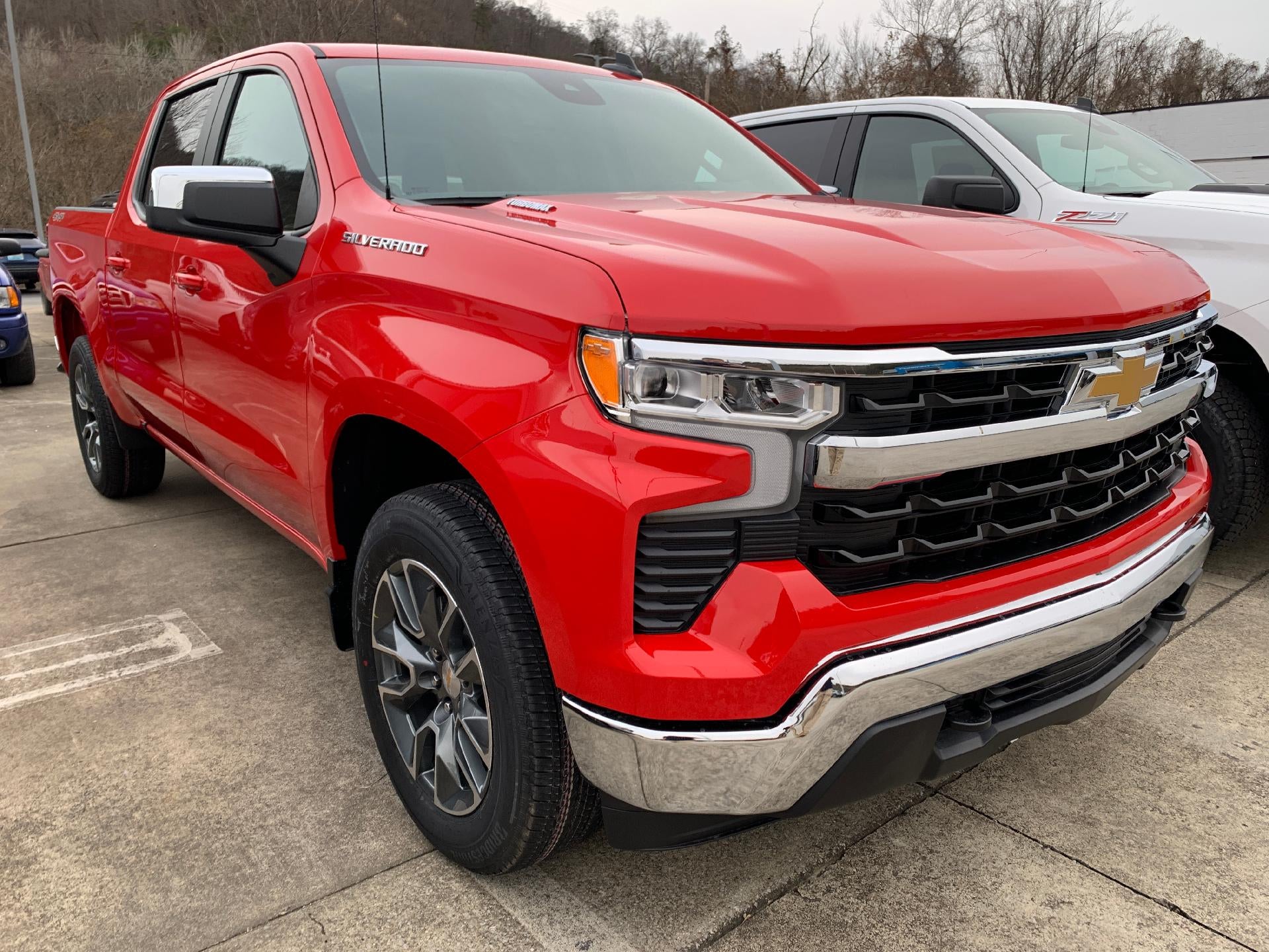 2026 Chevrolet Silverado 1500 LT Crew Cab 4x4 in Red Hot — front three-quarter view