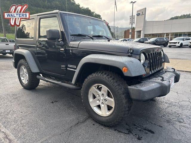 2011 Jeep Wrangler 4WD 2dr Sport in Black Clear Coat — front three-quarter view