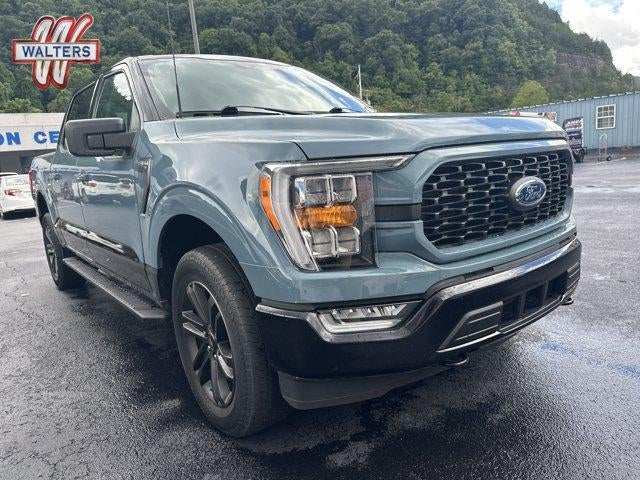 2023 Ford F-150 XLT 4WD SuperCrew 5.5' Box in Area 51 Blue — front three-quarter view