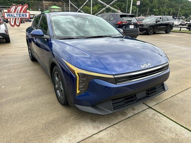 2025 Kia K4 LXS FWD in Deep Sea Blue — front three-quarter view